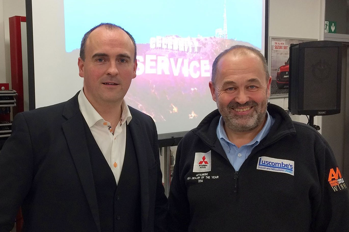 Geoff Ramm, left, took  Luscombe’s staff through exercises to boost their customer service skills